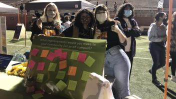 Sydney, Paola, and Adrianna at EPPC's table during Sunset Fest